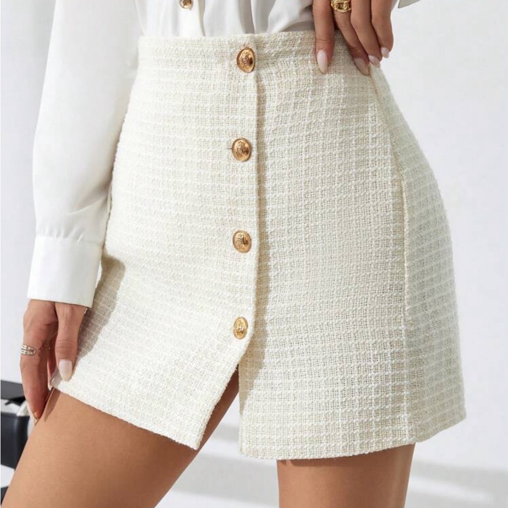 White mini skirt with gold buttons